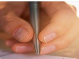 An employee with focal hand dystonia mentioned difficulty keeping up with prolonged writing tasks.